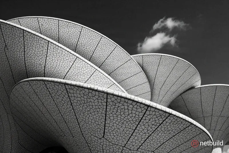 Abstract architectural cascading canopies, high-contrast monochrome, cracked mosaic tile texture, overlapping scalloped curves, dark sky, single wispy...